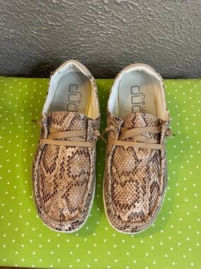 Hey Dude Women’s Snake-Print Slip-Ons in Brown and Tan